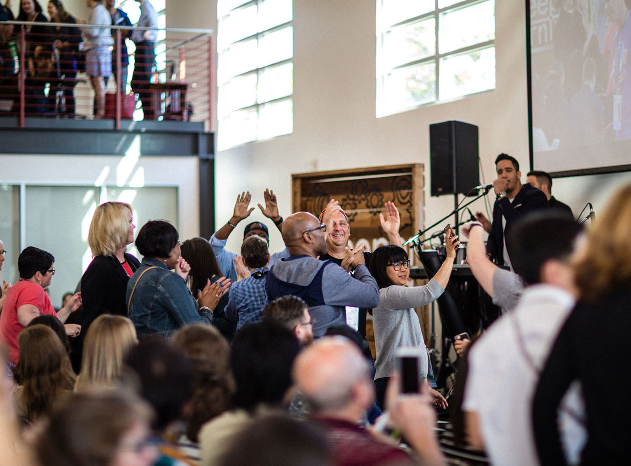 A crowd cheers the band onstage